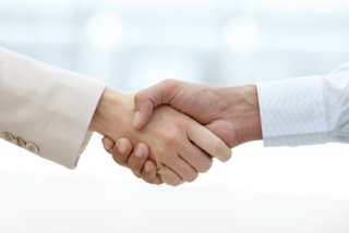 A close-up shot of a business handshake, symbolizing why relationship building is important in business.
